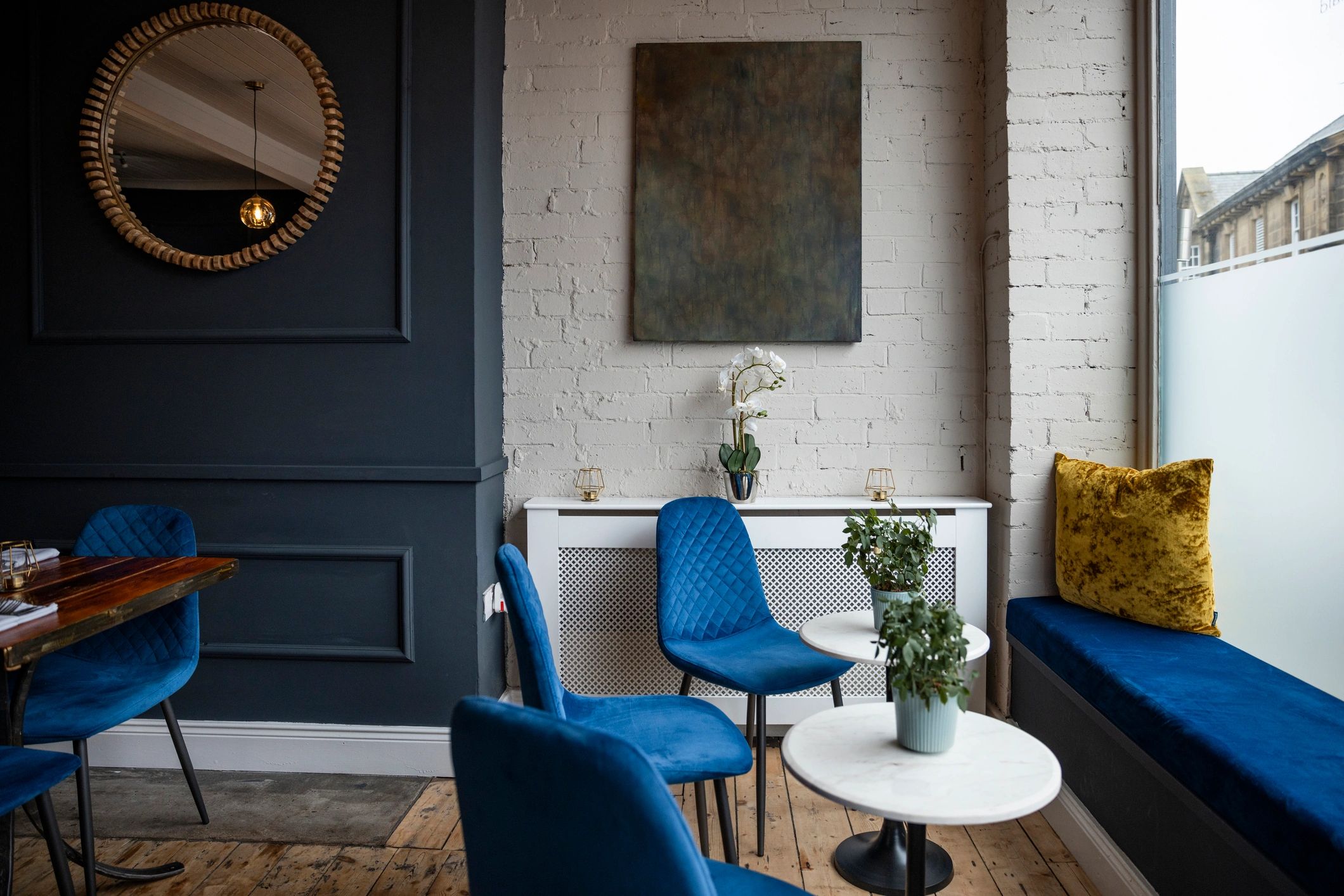 Modern salon-style interior with polished seating and premium atmosphere